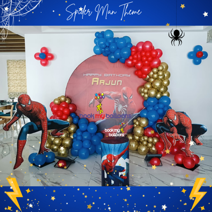 Spider-Man theme circular backdrop with an organic balloon arch in red, blue, and black, paired with stylish cake and dessert display drums.